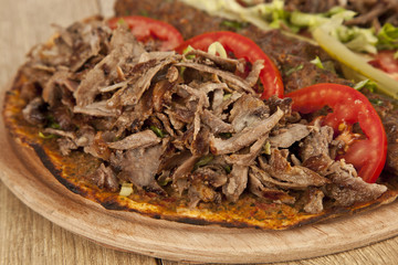 Fototapeta na wymiar Doner Adana Kebab with Lahmacun - Turkish pizza pide