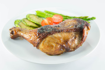 Closeup of roast chicken and vegetables