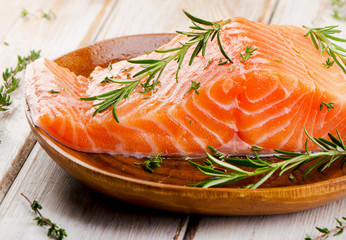 Fresh raw salmon fillet on cutting board