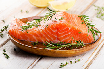 Raw salmon fillet on  cutting board