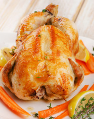 Roasted chicken  on  white plate