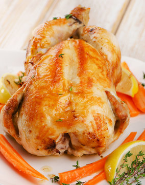 Roasted chicken  on  white plate