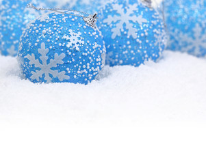 Christmas blue balls on the snow