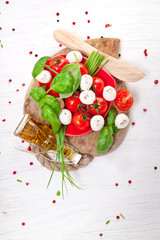 Mozzarella cheese with cherry tomatoes and basil