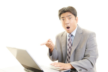 驚いた表情のビジネスマン