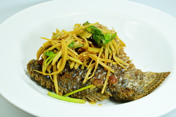 fried fish fillets soy bean and topping with slice ginger