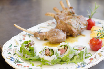 uramaki with lamb cutlet on serving dish