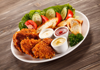 Fried chicken nuggets and vegetables