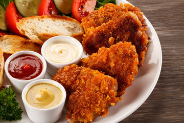 Fried chicken nuggets and vegetables