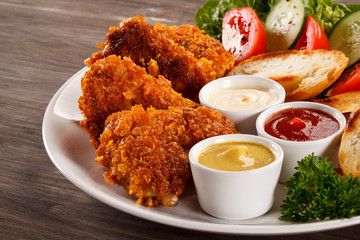 Fried chicken nuggets and vegetables