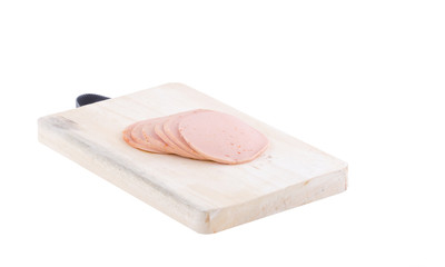 Sliced vegetarian bologna sausage on cutting board © Dourleak