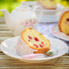 A Slice of Lemon and Caraway Seed Bundt Cake with Raspberries