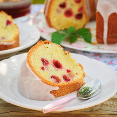 A Slice of Lemon and Caraway Seed Bundt Cake with Raspberries