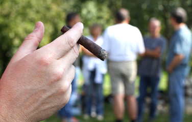 young smoker with fine cigar at school