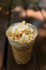 ice coffee with whipped cream and macadamia nuts