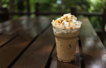 ice coffee with whipped cream and macadamia nuts