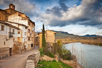 Fototapeta na wymiar Old town with temple and houses in Spain