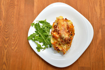 Cod baked with vegetables and cheese