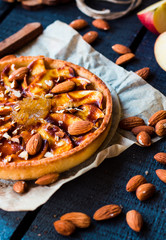 apple tart on a sand base with pear jam and caramel