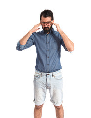 frustrated young hipster man over white background