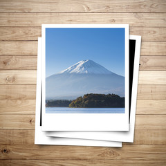 Mt. Fuji Japan memory on photo frame brown wood plank background