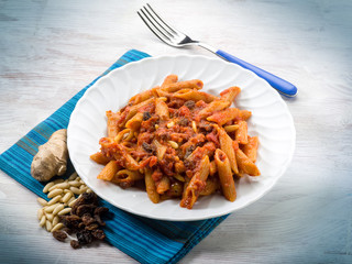 pasta with tomatoes dried grape and pine nuts