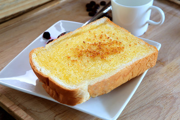 toast bread with butter and sugar on white plate ready to eat ,c
