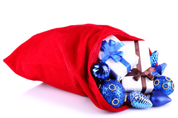 Red bag with Christmas toys isolated on white