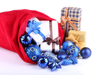 Red bag with Christmas toys and gifts isolated on white