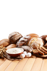 Fresh bread on table on white background