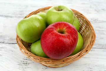 Juicy apples on wooden table