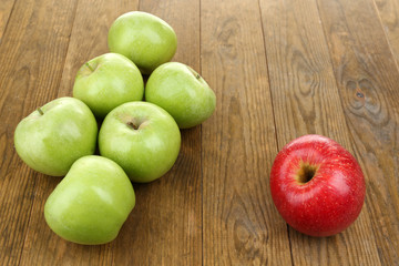 Juicy apples on wooden table