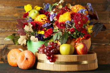 Beautiful autumn composition on wooden background