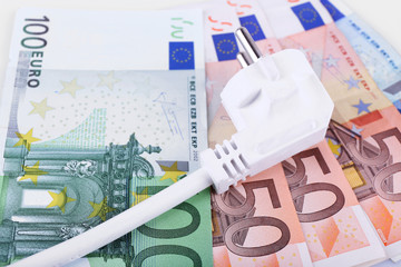 Cord with plug on euro banknotes background