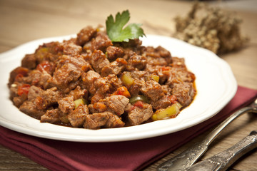 Meat Saute Turkish Et sote with wooden table