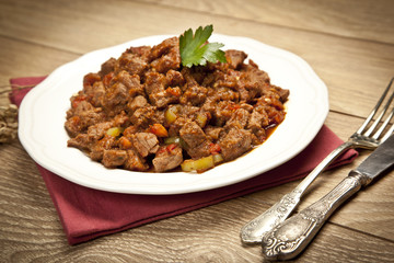 Meat Saute Turkish Et sote with wooden table