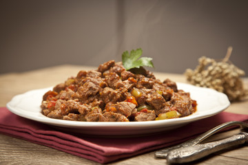 Meat Saute Turkish Et sote with wooden table