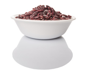 Red kidney beans in white bowl over white background