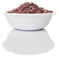 Red kidney beans in white bowl over white background