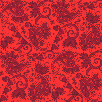Seamless paisley background of red Christmas colors