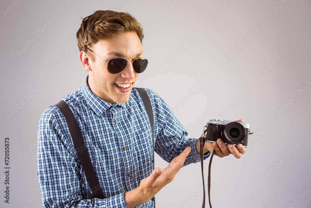 Aufkleber geeky hipster holding a retro camera