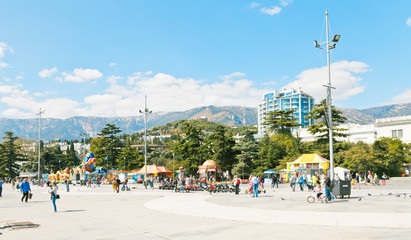 people on Lenin Naberezhnaya street in Yalta city