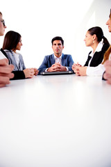 Businesspeople sitting at the table on a meeting