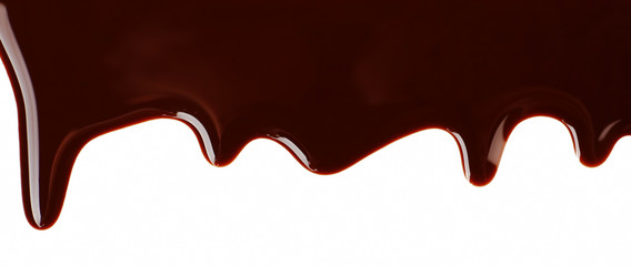 Melted chocolate dripping on white background