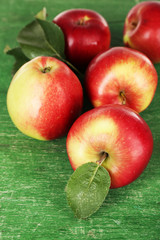 Ripe apples on wooden background