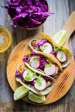 Fish tacoes on wooden background