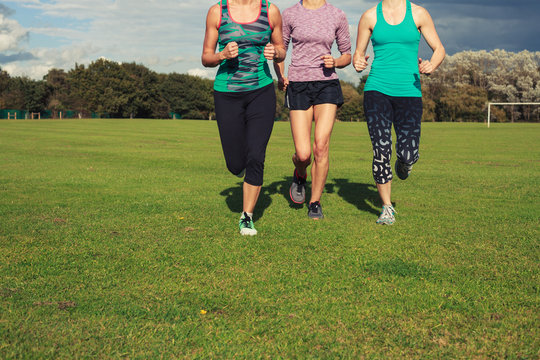 Three women running in the park