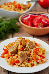 Uzbek national dish pilaf on plate