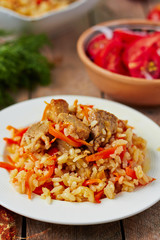 Uzbek national dish pilaf on plate