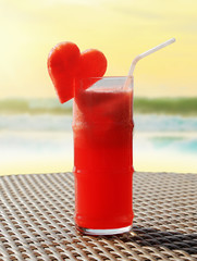 Fruity cocktail on a beach table